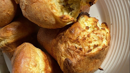 Plate of freshly cooked popovers made with Fraga Farm goat cheese