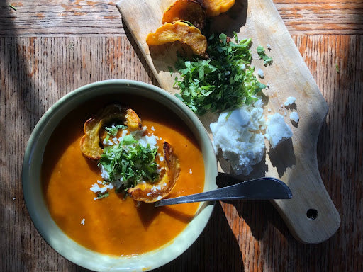 Picture of squash soup topped with chevre